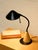 A fantastic vintage desk lamp with a playful geometric silhouette combining a warm wood cone base with a dramatically...
