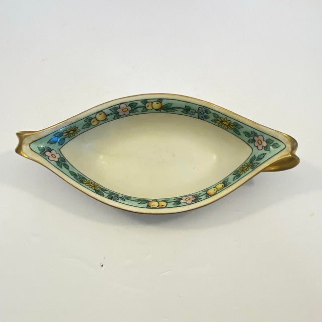 Fantastically vintage Japanese gilded porcelain relish dish from the 1970s. This piece features a light turquoise band...