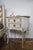 White bedside tables in the Louis XV style with decorative knobs in the Louis XVI style decorated with a gallant scene....