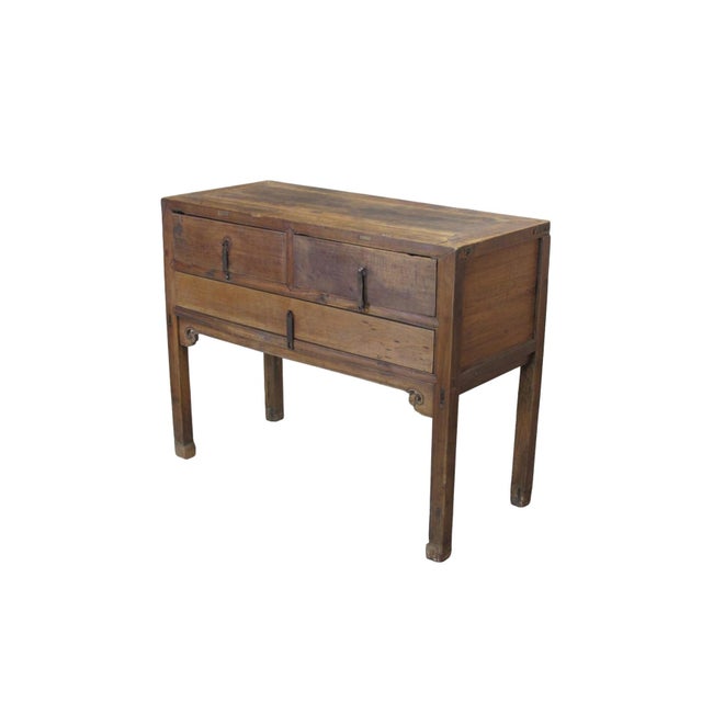 This mid-19th century versatile side table made from walnut wood features a classic three-drawer configuration, with two...