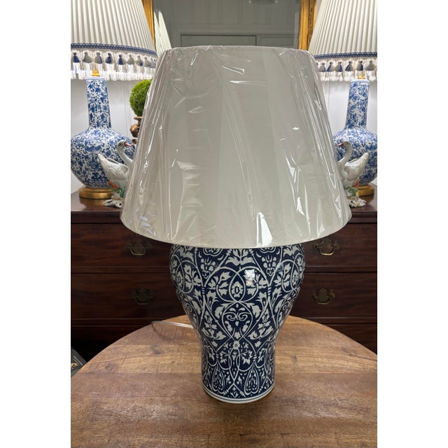Iconic and classic combat blue and white Ralph Lauren oversized lamp with white linen fabric shade. Brushed gold fittings...