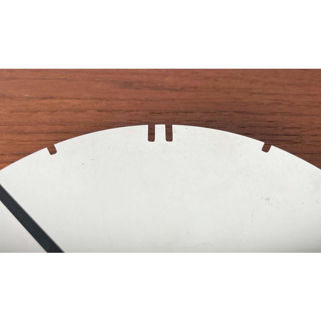 Postmodern German Chrome Wall Clock from Junghans, 1980s, in Very Good conditions. Designed 1980 to 1989 This piece has an...