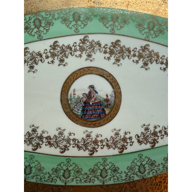 The product is a rare 1930 Le Mieux China 24k hand-painted large serving platter tray, measuring 15.5" x 9.5". This...