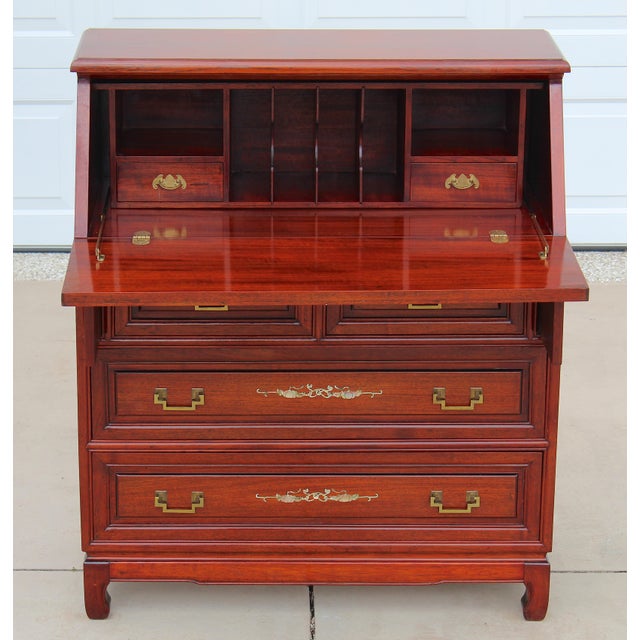 An elegant late 20th-century Chinese secretary desk crafted from richly grained rosewood and adorned with exquisite hand-...