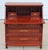 An elegant late 20th-century Chinese secretary desk crafted from richly grained rosewood and adorned with exquisite hand-...