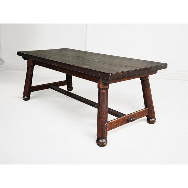 An exceptional dining set by french designer georges robert, comprising a solid wood table and six sculptural chairs...