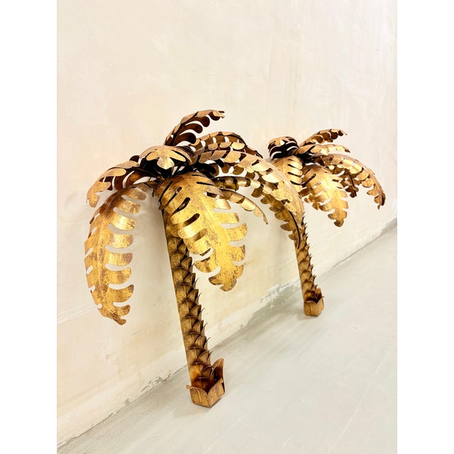 Large pair of palm tree wall sconces Brass In the style of Jansen 1970s European Plug (up to 250V).The wiring of this item...