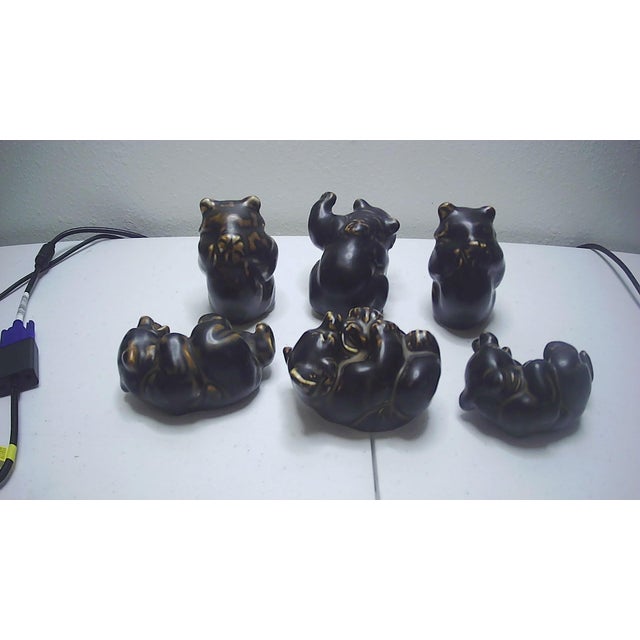 This vintage collectible set of 6 bear cub figurines by Royal Copenhagen, designed by artist Knud Kyhn, is a charming...