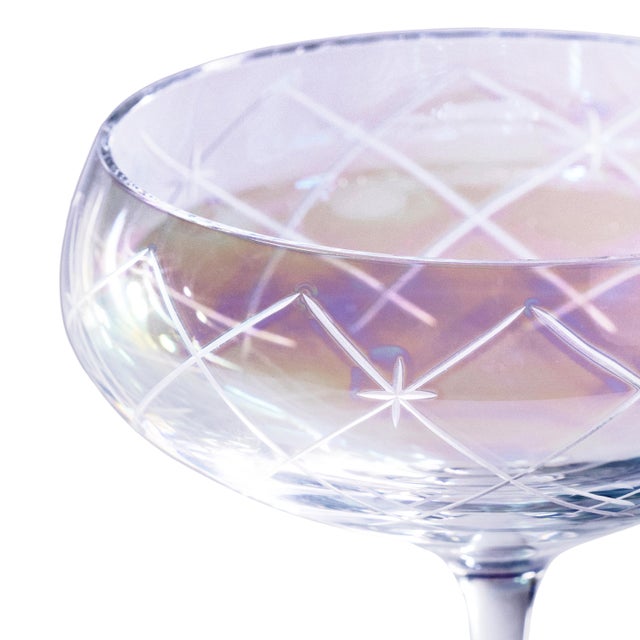 A stunning addition to any bar collection, this set of four coupe glasses features lustrous, hand-painted color cups with...