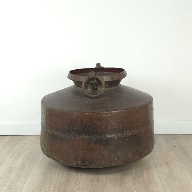 A massive antique copper cooking pot with inscription, India circa 1880. Probably from Gujarat. This piece has a good old...