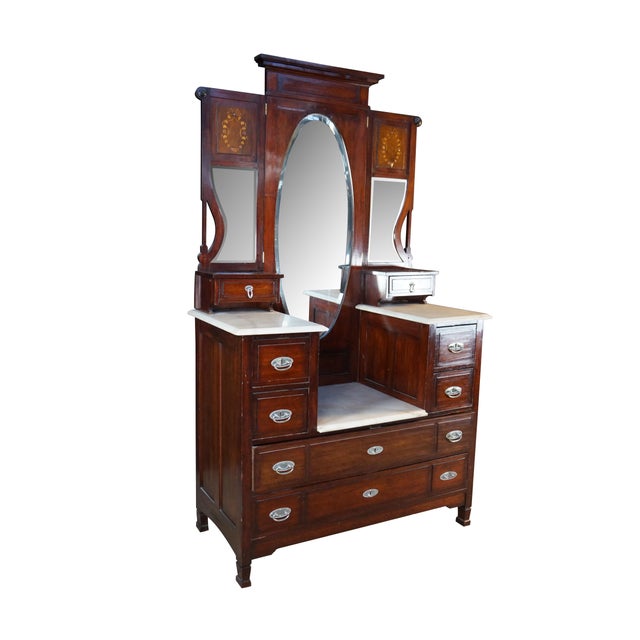 This stately antique Edwardian drop-center dressing table dates to the turn of the 20th century (circa 1890–1910) and is...