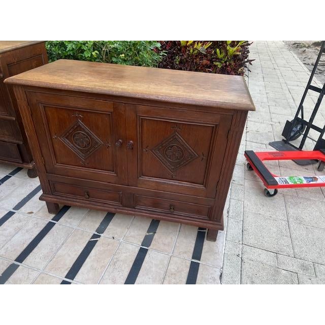This Antique English Solid Oak cupboard for linen etc. in the Jacobean style is a timeless piece of furniture crafted from...