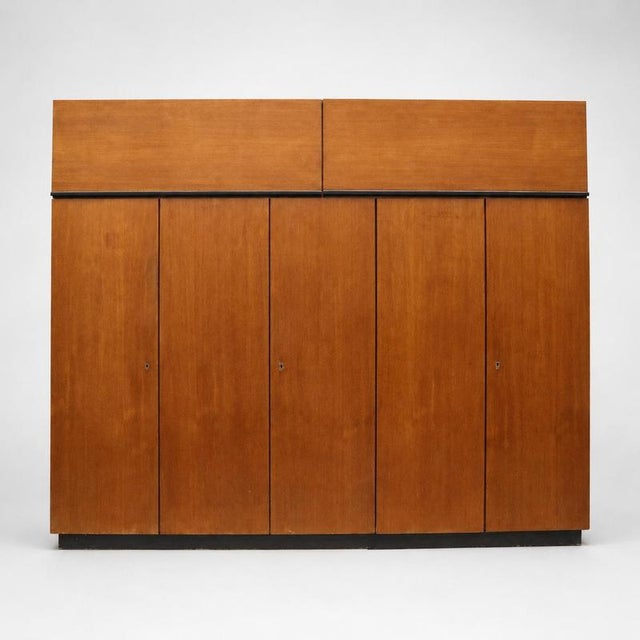 Large vintage teak wardrobe with hanging and shelving sections from the 1960s. Beautiful vintage teak wardrobe from the...