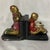 This vintage pair of Art Deco bookends features children reading and kneeling, crafted by makers like Armor Bronze Co.