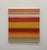 A contemporary abstract painting featuring layered horizontal bands in coral, crimson, golden yellow, blush, cream, and...