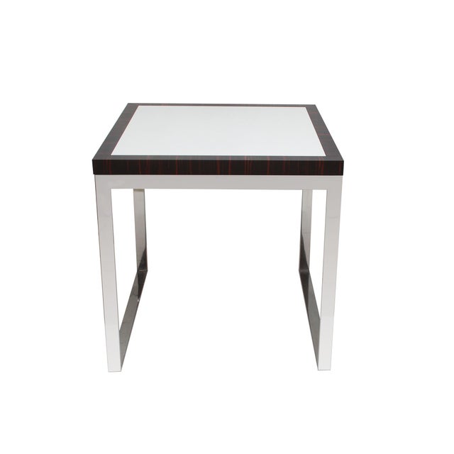 Stylish designer side table. Three equal sides of 81cm, cube-shaped. High-quality workmanship. High-gloss chrome-plated...