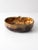 A vintage apple-shaped bowl by Dryden Pottery of Hot Springs, Arkansas, finished in a rich, flowing glaze of brown, amber,...