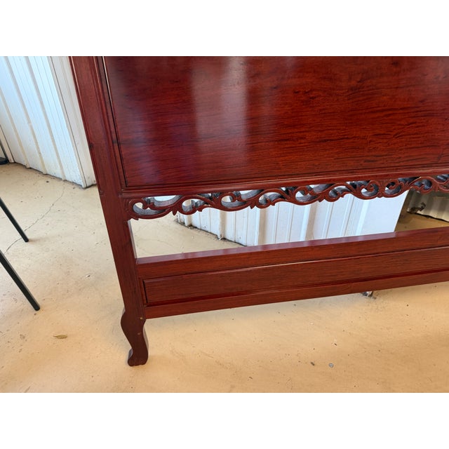 Solid rosewood full size headboard with double-arched crest, carved shell and leaf motifs, pierced scroll band, and...