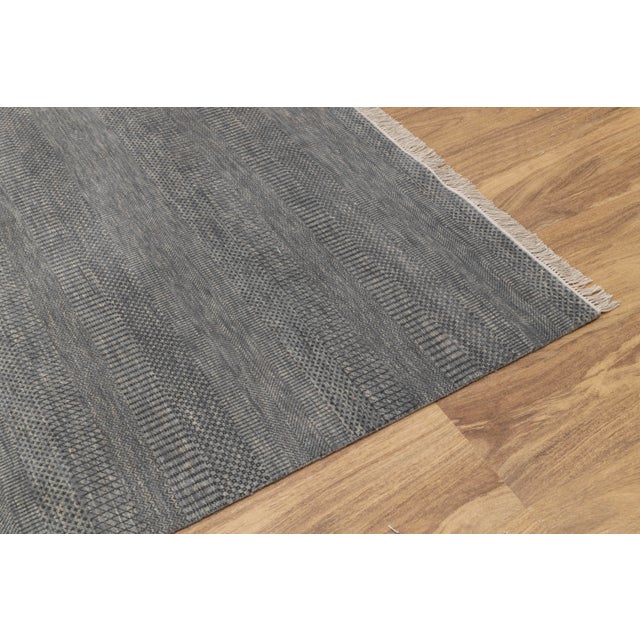 Featuring a super soft wool surface, the rug is easy to wash and maintain. Every inch of this rug is made by hand.