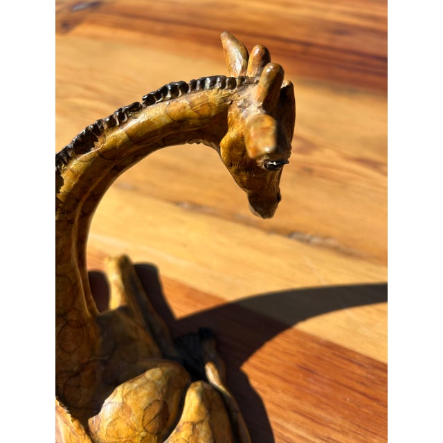 Adorable small treasure of a giraffe sculpture having faux painted iron and meticulous details.