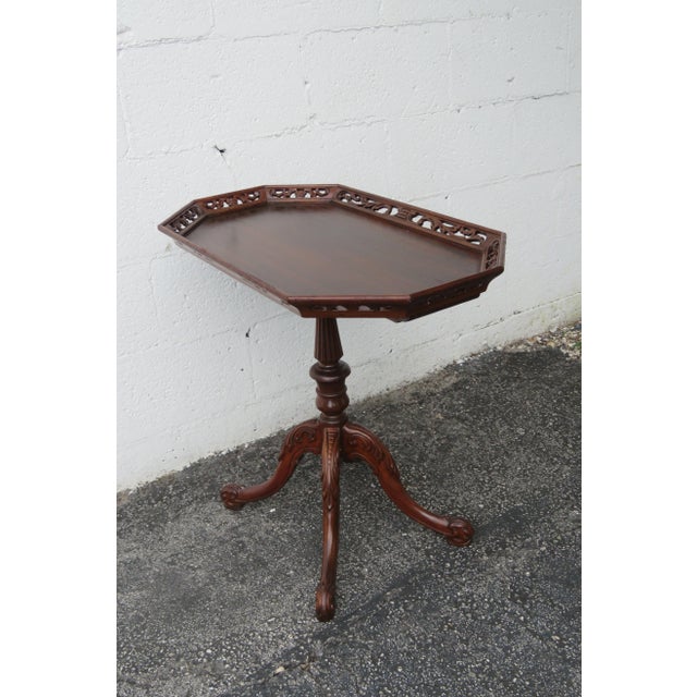 This Side Table is made of wood, mahogany, veneer, and is in good condition. This beautiful side table has a French style...