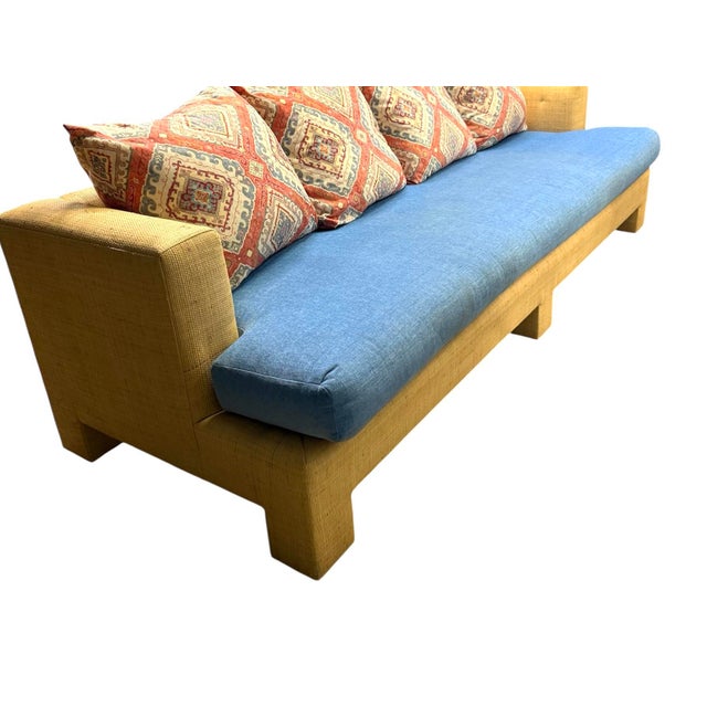 Billy Baldwin style sofa, upholstered on back, arms, body in Hinsons Madagascar Raffia. Seat cushion and pillows are...