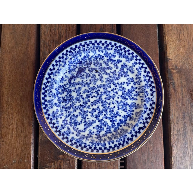 This plate is a piece of English Royal Worcester porcelainf eaturing the intricate "Blue Seaweed" pattern. This design is...