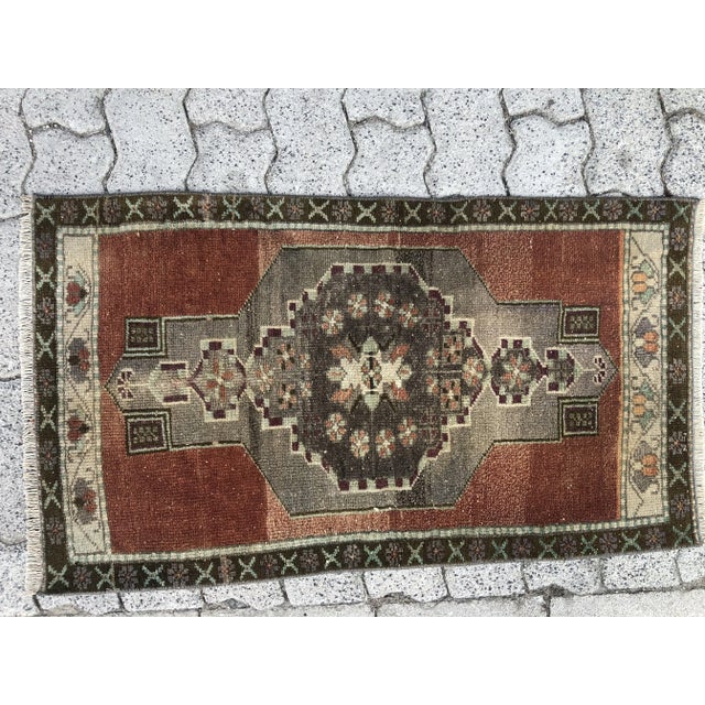 This is a vintage Turkish Oushak rug from the 1960s. The piece was hand-knotted.