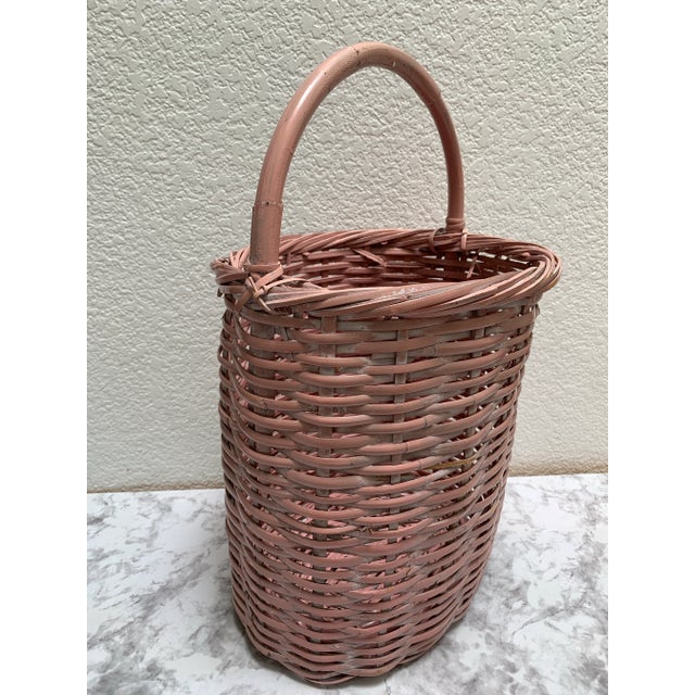 Rustic wood storage and decor basket with handle n an unexpected pale distressed pink. Perfect for rolls of toilet paper,...