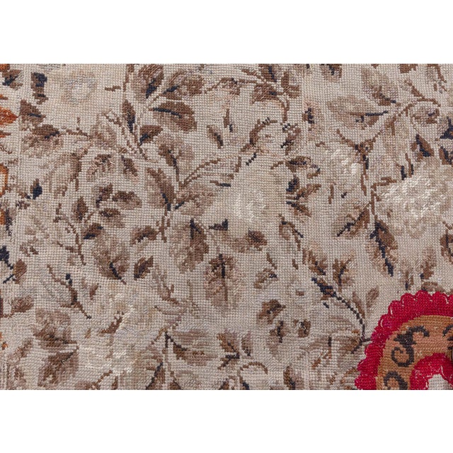 This exquisite European needlepoint rug from the 1880s is a remarkable testament to the refined artistry and craftsmanship...