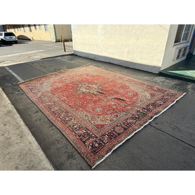 Design Plus Gallery presents a 9ft 6in × 12ft 7in Persian Tabriz Hand-Knotted Wool Area Rug. This traditional rug displays...