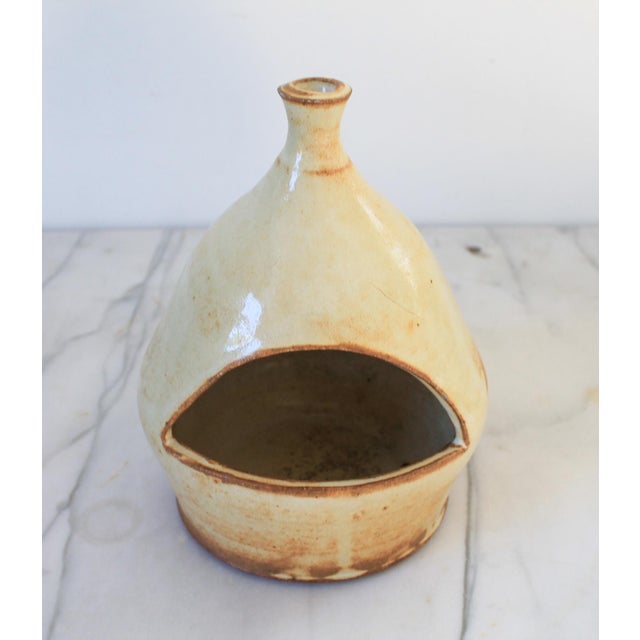 Vintage studio art pottery glazed vessel with front and top opening. Has drain hole on the bottom. Signed by artist on...