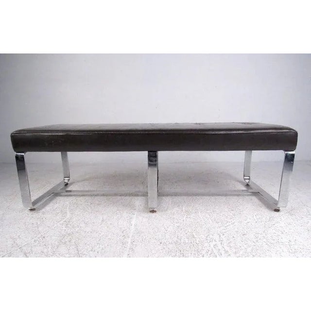 This stylish vintage bench seat features tufted leather upholstery and chrome base. At 61 inches wide this makes an ideal...
