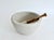 Large early 1900s porcelain mortar and pestle with a matte finish on thick walls with a pouring spout. The pestle has a...
