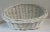 Nice vintage white wicker basket with lower side front than in back