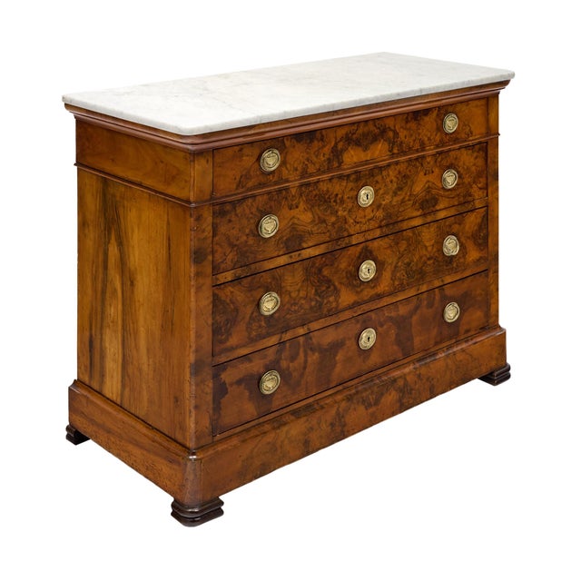 A superb French Restoration period chest of drawers, circa 1830, distinguished by its spectacular burled walnut veneer,...