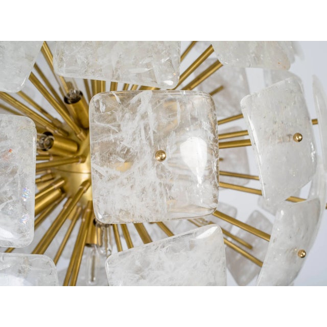 Large Sputnik chandeliers composed of solid brass body and 65" square convex rock crystal elements. All crystals were...