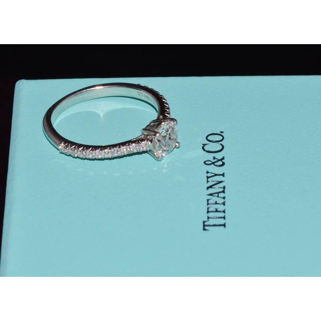 Genuine Tiffany & Co. Novo 950 solid platinum 0.81CTS diamond ring. This gorgeous classic solitaire engagement ring...
