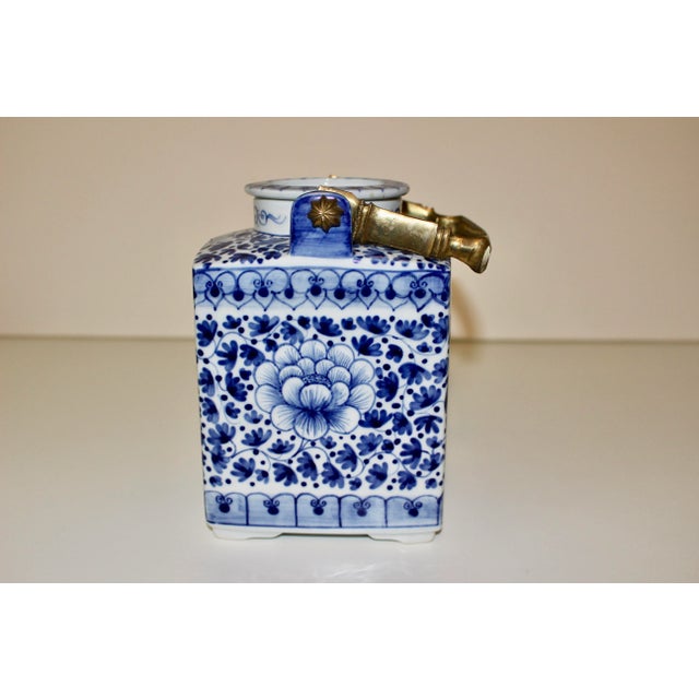 Vintage Tea Pot from the late 1970's in excellent condition. Beautiful, intricate porcelain design with a solid brass...