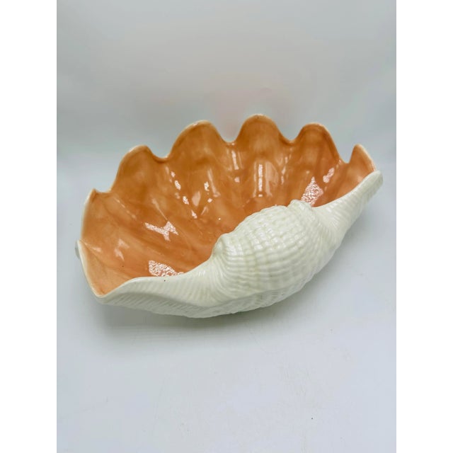 Such a pretty vintage piece! This clamshell bowl looks Italian but is not marked. White with a dark peach interior. It is...