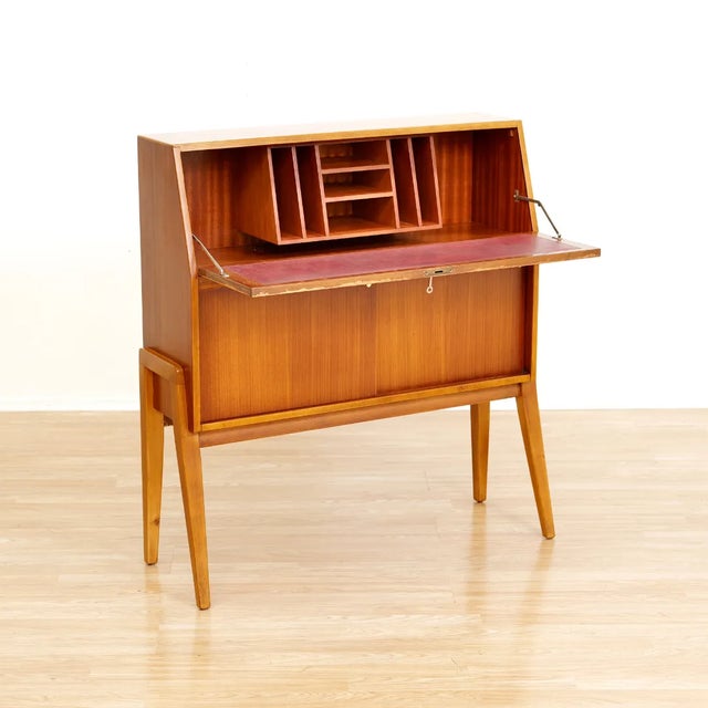 This fabulous mid century desk/cabinet was manufactured in England during 1960s. Produced by Greaves & Thomas this...