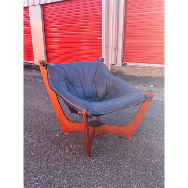 Iconic Mid-Century Modern Luna sling chair designed by Norwegian designer Odd Knutsen. This sculptural lounge chair...