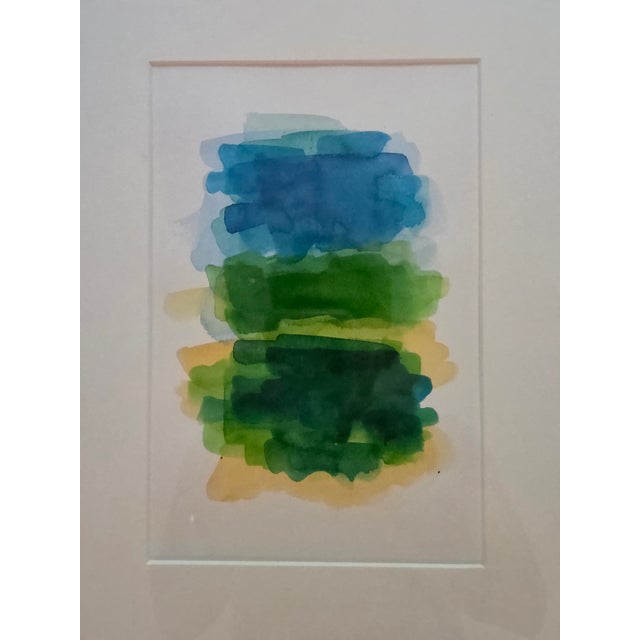 This captivating abstract watercolor evokes the contemplative, emotional depth of Color Field abstraction with a luminous...