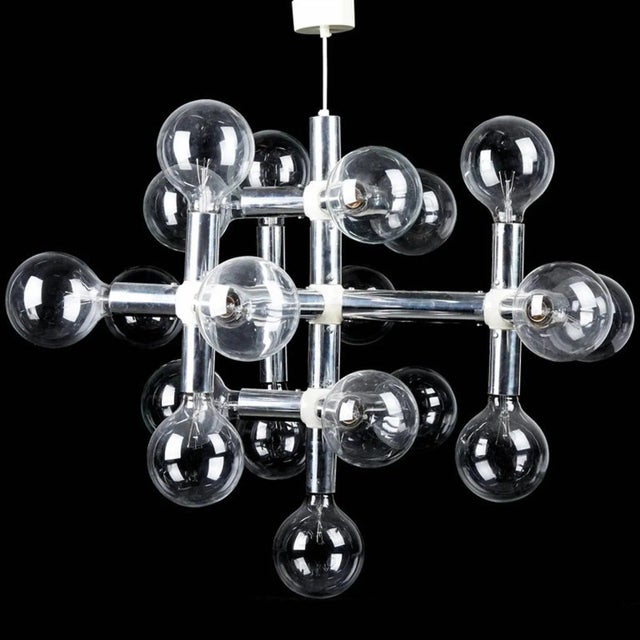 This C 300 series chandelier was designed by Trix and Robert Haussmann and produced by Swiss Lamps International in the...