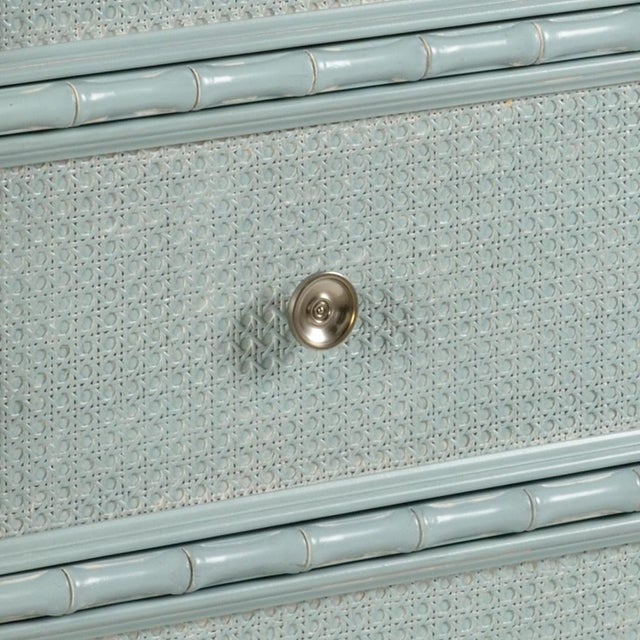 blue with white glaze finish on four drawer bamboo motif chest. drawer fronts are covered with woven caning and satin...