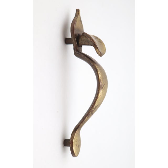 Vintage Colonial style vertical cabinet door pull made of brass with a patina finish. Made by Keeler Brass Co. Style No....