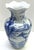 Elegant vintage Chinese blue and white porcelain vase featuring a beautifully detailed traditional scenic design. The...
