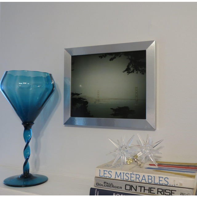 Iconic Golden Gate Bridge on a misty day .Digitally color enhanced original photography framed under glass. Overall framed...