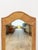 This tall rectangular arched wall mirror features a pencil reed frame, showcasing the fine, tightly woven detailing that...