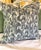 Designer accent pillow by Emily Daws featuring a sophisticated blue-gray and white botanical silhouette print with a soft...